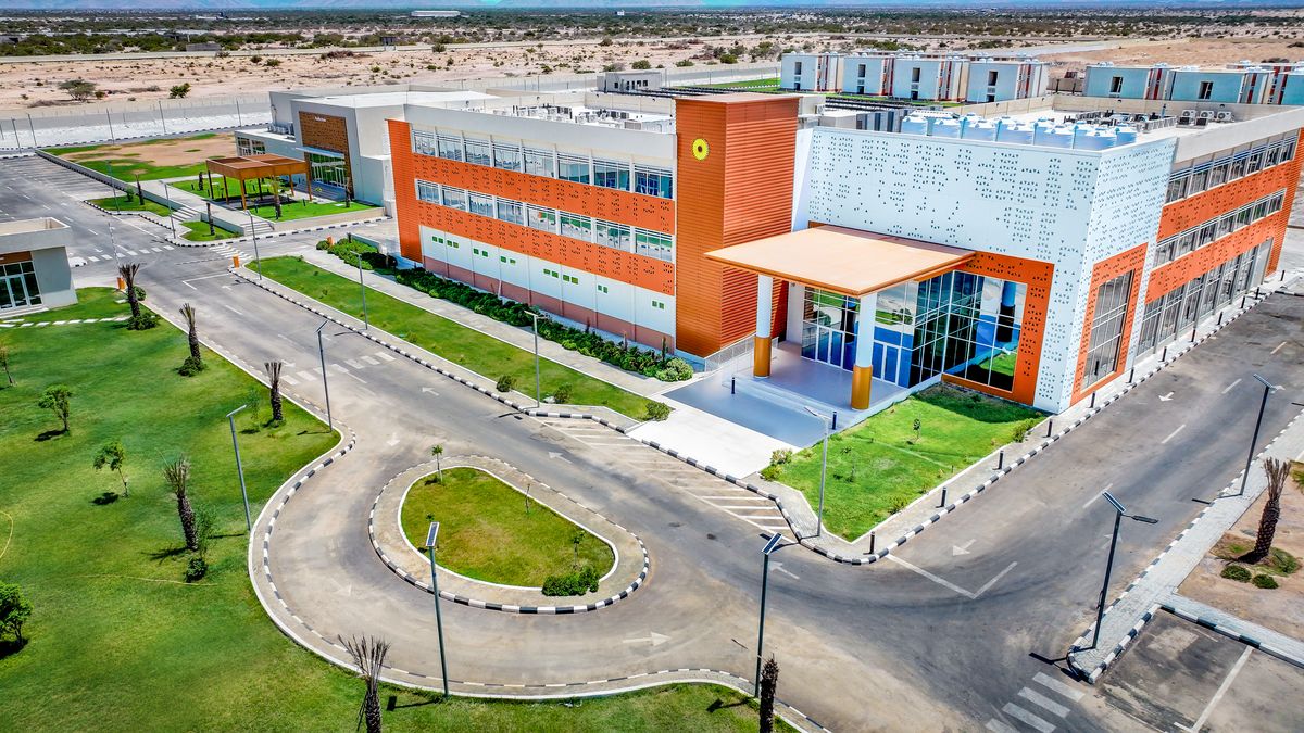 Aerial view of the main hotel building, its entrance drive and lawns