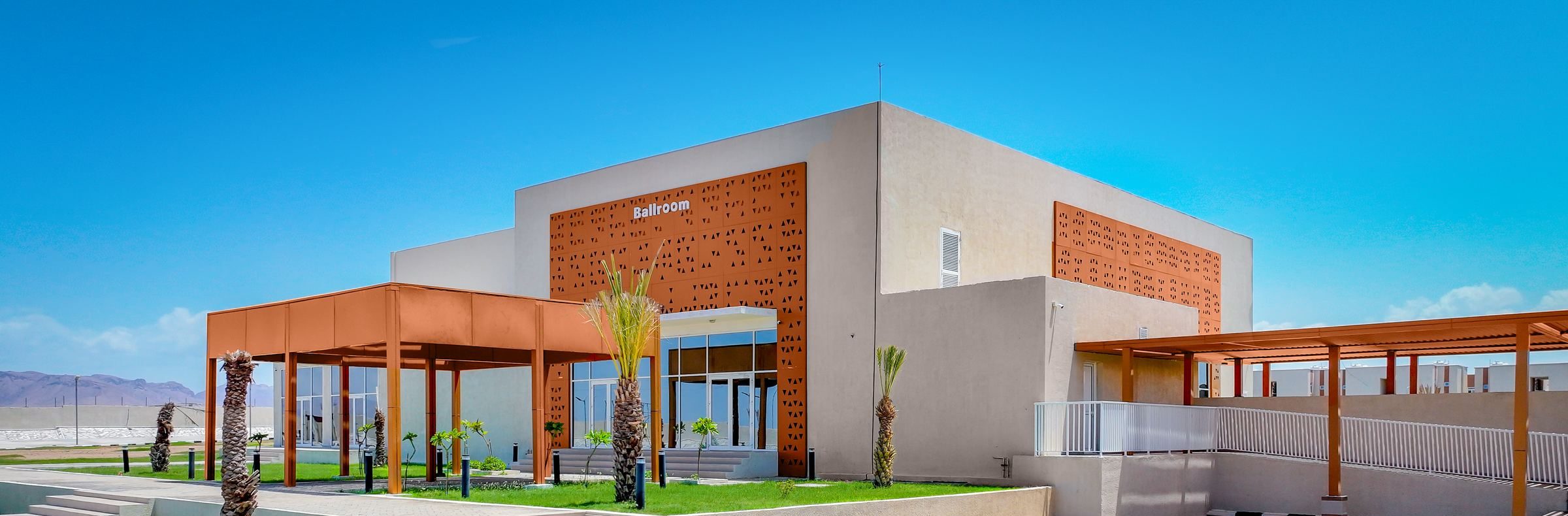 The Ballroom building, with its terracotta screen, palm trees and covered walkways
