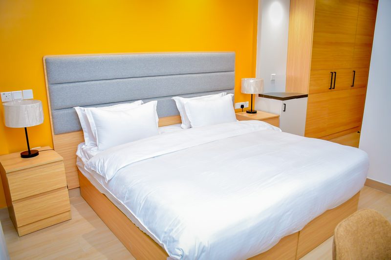 Deluxe Room with a double bed and wardrobe