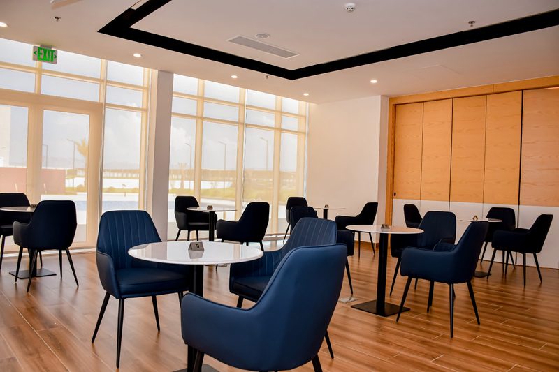 Restaurant tables beside floor-to-ceiling windows