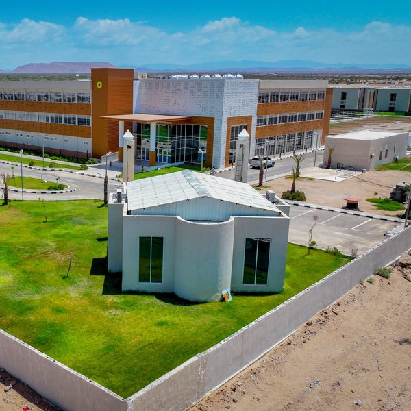 Aerial view of the mosque in front of the main hotel building